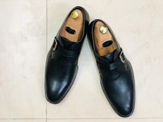 New Handmade Men's Black Monk Strap Leather Shoes, Men Designer Dress Formal Shoes  Shoes Detail  Upper: High Quality Leather  Inner: soft leather  Sole:Leather Gender:Male Heel:Leather Totally Hand stitched Manufacturing time 7-10 business days If you can’t find your Size/Color just send us message we will make for you.  Measurement Size. (required measurement for better fit) We can custom make these Boots in ALL sizes; The standard measurements are given in SIZE CHART IMAGE. Please feel free t Black Monks, Cap Toe Shoes, Brogues Men, Slipon Shoes, Leather Formal Shoes, Monk Strap Shoes, Handmade Leather Shoes, Formal Shoes For Men, Mens Black Leather