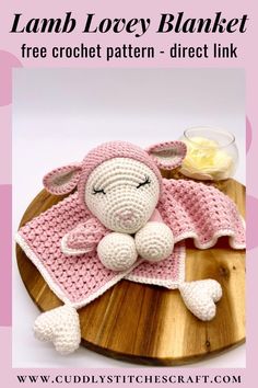 a crocheted lamb blanket sitting on top of a wooden board with the text lamb lacy blanket free crochet pattern - direct link