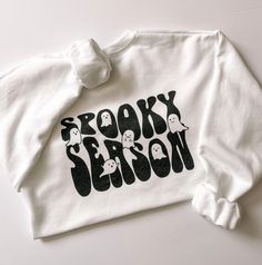 The cutest spooky season crewneck featuring two pocket size ghosts on the front and a spooky season party on the back! Cotton Blend. Design has a soft vintage look due to our eco-friendly water based dying process. Unisex sizing. Order your normal size or size up for a more relaxed, oversized fit. Recommended care: Machine wash cold inside out, tumble dry. Spooky Season Crewneck, Cricut Sweatshirt Ideas, Spooky Season Outfits, Etsy Sweatshirts, Cricut Clothes, Fall Szn, Mom Clothes, Tee Ideas, Holiday Pjs