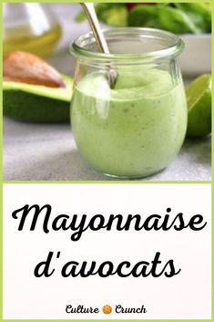 mayonnaise d'avocats in a glass jar with a spoon on the side