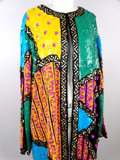 "This beautiful vintage piece fully embellished with bright sequins and beads in a retro color block design. It's in excellent condition! Measurements are taken with the front brought together.. Bust - 60\" Shoulders - 20\" Sleeves - 25\" Length - 32\" All of my items come from a smoke-free and pet-free home. If you have any questions, please don't hesitate to ask!" Vintage Embellished Outerwear For Festivals, Vintage Festive Sequin Outerwear, Vintage Sequined Outerwear For Festive Season, Vintage Sequined Outerwear For Festive Occasions, Festive Sequined Outerwear For Festivals, Bohemian Sequined Festive Outerwear, Festive Bohemian Sequin Outerwear, Vintage Multicolor Outerwear For Festive Occasions, Bohemian Party Outerwear With Sequins