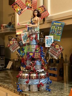 a cake made to look like a birthday cake with decorations on top and balloons in the air