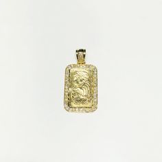 A handcrafted gold bar pendant featuring Lady Fortuna's profile bordered by shimmering white diamonds. Precious Metal: 14 Karat Yellow Gold Gemstone: White Diamonds Round Brilliant Cut: (Approx. 1.30 Cts.) Height: 46 mm Width: 23 mm Available Weight: ~16.6 grams* To check availability in other sizes and designs please inquire via e-mail or Instagram DM if necessary. *All weights are approximate. **Necklace sold separately. Please contact us if you have further questions about alternate sizes or Rectangular Gold Diamond Jewelry, Yellow Gold Diamond Rectangular Pendant Jewelry, Yellow Gold Diamond Pendant Jewelry, Gold Rectangular Pendant Jewelry Stamped 14k, Gold Diamond Rectangular Necklace, Rectangular Gold Jewelry With Diamond Accents, Gold Cubic Zirconia Rectangular Pendant Jewelry, Gold Diamond Jewelry With Rectangular Stone, Gold Diamond Necklace With Rectangular Shape