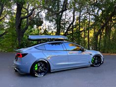 a car parked in front of some trees