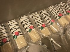 there are many decorated cookies wrapped in plastic