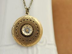 Custom antiqued brass based floral round locket necklace decorated with mini working compass charm on top, locket fits 25mm wide picture and it hangs on 18 inch antiqued brass chain with lobster clasp. Measurement: Locket is about 1.2 inch (33mm) wide and it's on 18 inch chain as shown in last picture. Want shorter or longer length for your chain? Simple choose a difference length for it when checking out. More locket necklaces listed here, https://www.etsy.com/shop/plasticouture?ref=listing-sho Bohemian Brass Locket Necklace, Antique Gold Medallion Locket Necklace In Bohemian Style, Antique Gold Bohemian Medallion Locket Necklace, Antique Gold Bohemian Locket Necklace, Bohemian Antique Gold Medallion Locket Necklace, Vintage Compass Pendant Jewelry, Vintage Round Compass Jewelry, Bohemian Brass Medallion Locket Necklace, Bronze Compass Design Jewelry Gift