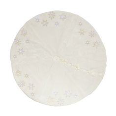 a white round table cover with snowflakes and stars on the top, sitting in front of a white background