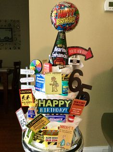 a birthday cake made to look like it has many different signs on the top and bottom