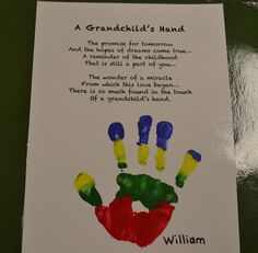 a child's handprint is displayed on a card