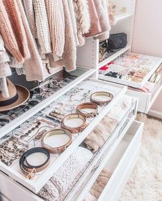 an organized closet with lots of items on the shelves and in it's drawers