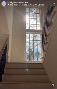 the stairs lead up to an open window