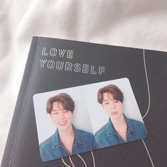 an open book with two pictures of someone's face and the words love yourself on it