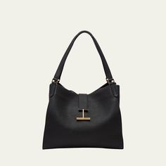 TOM FORD "Tara" tote bag in leather, faux leather (polyurethane), and brass  Flat shoulder straps  Open top with T-strap magnetic closure  Interior, one zip pocket  Lining: Polyurethane Approx. 12.2"H x 14.4"W x 7.1"D Item Weight (Lbs.): 2.1 Made in Italy Open Top, T Strap, Large Tote, Leather Tote Bag, Magnetic Closure, Tom Ford, Tote Handbags, Leather Tote, Shoulder Straps