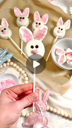 a person is holding up some bunny lollipops