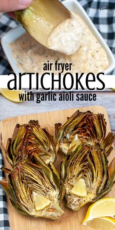 air fryer artichokes with garlic aioli sauce on a cutting board