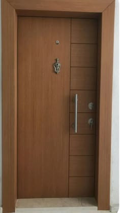 the door is made of wood and has metal handles