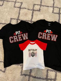 two t - shirts with the words pit crew and birthday boy on them sitting on a carpet