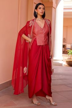 Shop for these amazing collections of Red Cape Organza Embroidery Tilla Cape Open Ratan Draped Skirt Set For Women by Isha Gupta Tayal online at Aza Fashions. Isha Gupta, Organza Cape, Indian Suit, Embroidered Cape, Sleeveless Waistcoat, Organza Embroidery, Diwali Outfits, Traditional Indian Dress