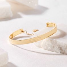 Preserve a special day forever with the Gwen Date Cuff Bracelet. Personalize your cuff with your choice of dates and choose between rose gold, yellow gold, or rhodium plating options for a completely unique piece. A lovely gift for graduations, engagements, anniversaries, and birthdays! Available in 14k gold plated, rhodium plated or 14k rose gold plated brass Width: 1/4" Length: 5 1/2" Made in the USA With engraving this item is FINAL SALE SKU: BYB1034 Classic Adjustable Rose Gold Bangle, Tarnish Resistant Classic Promise Bracelets, Classic Adjustable Rose Gold Cuff Bracelet, Engraved Rose Gold Bracelets For Wedding, Tarnish Resistant Adjustable Bracelets For Anniversary, Adjustable Tarnish Resistant Bracelets For Anniversary, Tarnish Resistant Gold Cuff Bracelet For Anniversary, Gold Tarnish-resistant Cuff Bracelet For Anniversary, Engraved Rose Gold Cuff Bangle Bracelet