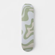 a skateboard with green and white designs on the front, against a white background