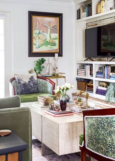 a living room filled with furniture and a flat screen tv