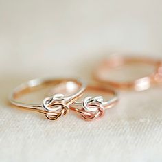 Double Love Knot Ring - The lover’s knot or love knot has a long history of being a symbol of love. It is used to represent the unbreakable bond and eternal connection between two persons. Each ring band is approximately 1mm thick. Available in Sterling Silver, Rose Gold filled & Gold filled. Choose the same metal for both rings or have it mixed up! Need help with sizing? Purchase our ring sizer or look at our ring size guide. Lovingly handcrafted in Australia. Each Stamp + Shine piece is made from scratch in our little studio in Melbourne, Australia. The process begins with a clean metal sheet/ wire, which is then cut, polished, hand stamped, drilled, filed and assembled by hand into its final form. As a result, there will be slight variations in spacing and alignment, no two pieces are e Love Knot Engagement Rings, Adjustable Rose Gold Couple Rings For Promise, Infinity Knot Ring, Clean Metal, Love Knot Ring, Infinity Knot, Crescent Necklace, Oval Necklace, The Lover