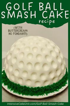 a white cake with green grass on top and the words golf ball smash cake recipe