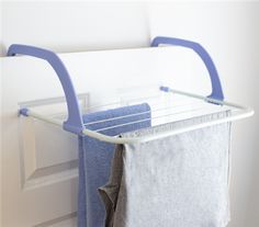 a blue and white towel rack on the wall