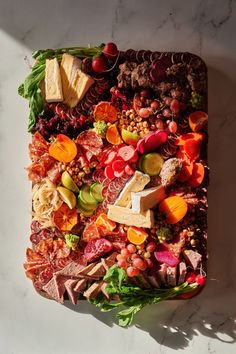 an assortment of meats and vegetables on a platter