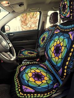 the interior of a car is decorated with colorful crochet