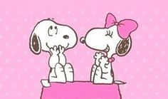 two cartoon dogs sitting on top of a pink box with the words love is in the air