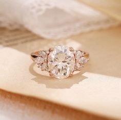 a diamond ring sitting on top of a piece of paper