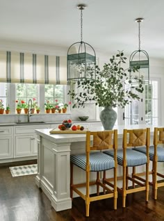 a kitchen filled with lots of counter top space next to a dining room table and chairs