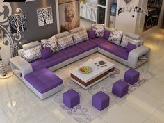 a living room filled with lots of purple furniture and decor on top of white tile flooring