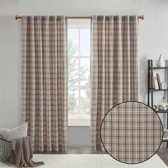 a living room with white walls and curtains on the windowsill, along with a window curtain