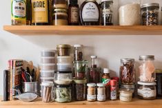 the shelves are full of spices and condiments