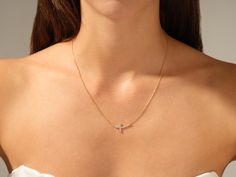 Shine with luxurious style with this 14k gold Sideways Cross necklace. The pendant is perfect for any occasion, from a special night out to an everyday staple. FEATURES • Made to Order • Gold Kt: 14k Solid Gold, 18k Solid Gold • Gold Color: Rose Gold, Yellow Gold, White Gold • Available Length Range: 14 Inches - 20 Inches (Custom lengths are also available upon contact) • Available Gemstone: Diamond, Moissanite • Diamond Cut: Round • Diamond Color - Clarity: G Color - SI1 Clarity • Number of Sto Sideway Cross Necklace, Elegant Cross Pendant Diamond Necklace For Formal Occasions, Elegant 14k Gold Diamond Cross Pendant Necklace, Elegant Diamond Cross Pendant Necklace, Elegant Yellow Gold Diamond Necklace With Cross Pendant, Elegant Yellow Gold Diamond Cross Pendant Necklace, Elegant Yellow Gold Cross Pendant Diamond Necklace, Elegant Cross Pendant Jewelry For Party, Elegant Party Jewelry With Cross Pendant