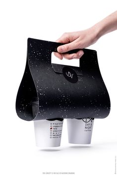 two coffee cups are being held up to each other by one hand and the other is holding an empty cup