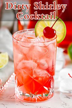 a drink in a glass with a cherry and lime garnish