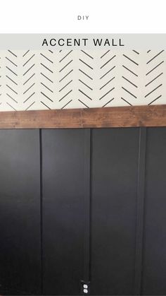 the diy accent wall is painted black and white with an arrow pattern on it