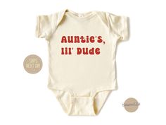 Let your nephew show off his adorable style with our "Auntie's Lil' Dude" Shirt! Made from soft, breathable fabric to keep him comfortable all day long. Features a charming design and playful slogan that celebrates the special bond between auntie and nephew. Perfect for family gatherings, playdates, or everyday wear. Available in a variety of sizes to suit boys of different ages, ensuring the perfect fit. Treat your little guy to this cute and cozy shirt that will make him feel extra special! Ha Auntie Shirts For Nephews, Auntie Onsies For Babies, Nephew Onesie, Auntie And Nephew, Aunt Things, Aunt And Nephew, Auntie Baby Clothes, Bug Board, Nephew Shirts