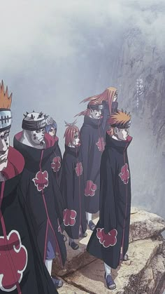 several anime characters standing on top of a mountain