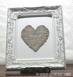 a white frame with a heart cut out of it