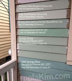 the side of a house that has been painted with different colors and names on it