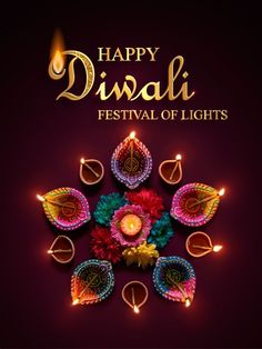 happy diwali festival of lights with colorful flowers and candles in the middle on dark background