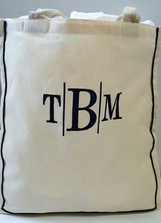 "THIS SPACIOUS CARRY ALL MONOGRAMMED BAG IS THE PERFECT ACCESSORY THIS SEASON. THE LARGE EMBROIDERY DESIGNS MAKE THIS BAG STAND OUT WITH ANY WARDROBE. BAG DETAILS 15\"W x 16\"H x 6\"D 22\" inch handles 😍 ORDERING INSTRUCTIONS 😍 CHOOSE YOUR MONOGRAM FONT STYLE 😍 CHOOSE YOUR THREAD COLOR 😍 ADD YOUR PERSONALIZATION DETAILS 🌴IMPORTANT: WHEN ADDING YOUR 3 LETTER MONOGRAM LETTERS PLEASE USE THE FORMAT PROVIDED IN THE PERSONALIZATION BOX. ⭐HOW YOU SEND US THE INITIALS IN THE NOTE TO SELLER'S BOX I Tan Travel Bag With Monogram, Tan Monogram Travel Bag, Black Rectangular Monogram Bag, Bridal Party Bags, 3 Letter Monogram, Wake Forest Nc, Couples Monogram, Monogram Pillows, Market Bags