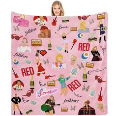 a woman is holding up a pink blanket with many different things on it and the words red