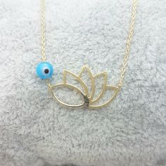 - Lotus Necklace is made with high quality 14K real solid gold. - Lotus Flower Necklace for women is beaded with evil eye. It is optional. - This cute, charm, dainty, delicate, elegant and trendy 14K Real Solid Gold Lotus Necklace for Women has been artfully designed for timeless fashion. - You receive lotus jewelry in a beautiful and free gift box - Free shipping (Arrive within 4 business days to the USA and Canada) - Simple Lotus Flower Necklace is a perfect and special gift for your mother, m Rose Gold Evil Eye Necklace Gift, 14k Gold Evil Eye Charm Necklace As Gift, Gold Lotus Flower, Lotus Flower Necklace, Snowflake Bracelet, Turquoise Gold Ring, Lotus Jewelry, Lotus Necklace, Gold Lotus