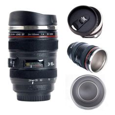 a camera lens coffee mug with the lid open and two cups next to it on a white background