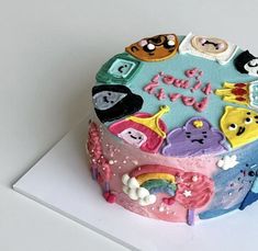 a birthday cake decorated with cartoon characters on it